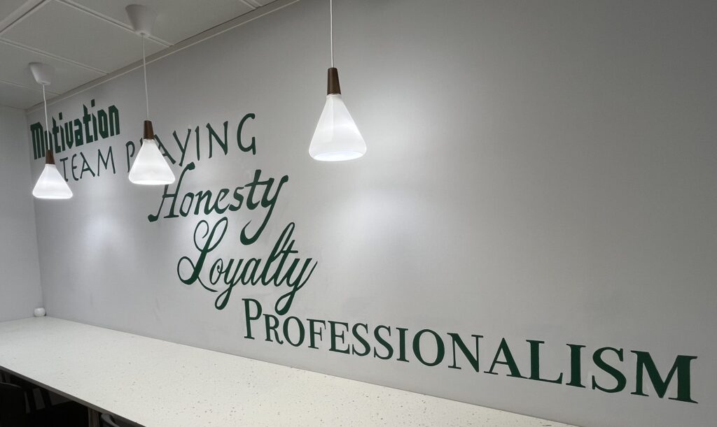 Mural in a lawyers Office painting in their branded colours of their Ethos and work ethics 